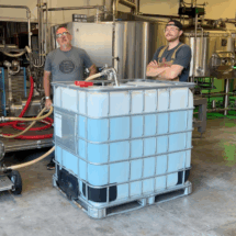 2 Recycled water tote with some of the Devil's Canyon team