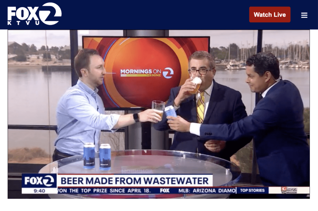 Epic CEO Aaron Tartakovsky cheers-ing the FOX2 KTVU hosts with Epic OneWater Brew