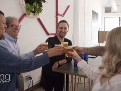 Epic Cleantec employees cheersing with our OneWater Brew on CNN's Going Green series