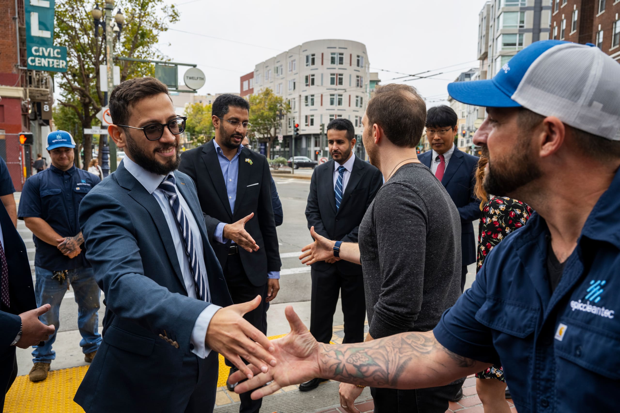 A Epic team member shakes hands with a curious guest during one of our behind-the-scenes tours
